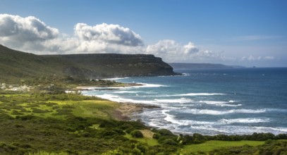 Sardinia, mountainous coastal landscape by the sea, blue sky with clouds, Bosa, Europe, Province of
