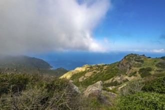 Sardinia, Mountainous coastal landscape by the sea, blue sky with clouds, Bosa, Europe, Province of