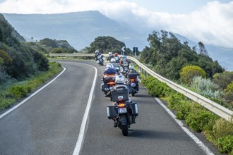 Sardinia, biker motorcyclist on the mountainous coastal road, Villanova Monteleone, Europe,
