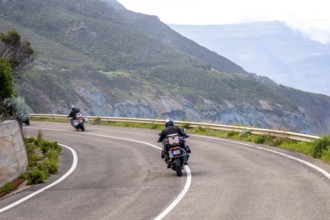 Sardinia, biker motorcyclist on the mountainous coastal road, Villanova Monteleone, Europe,