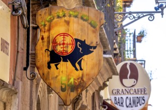 Sardinia, business sign with wild boar and target, Bosa, Europe, province of Oristano, Italy,