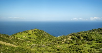 Sardinia, Mountainous coastal landscape by the sea, blue sky with clouds, Bosa, Europe, Province of
