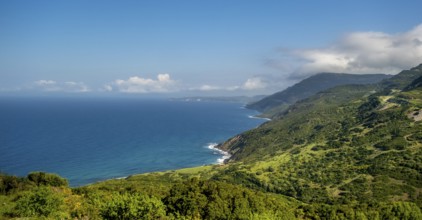 Sardinia, Mountainous coastal landscape by the sea, blue sky with clouds, Bosa, Europe, Province of