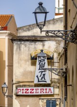 Sardinia, Ristorante Pizzeria sign, streetlamp on house wall, old town, Alghero, Europe, province