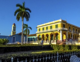 Centre of Trinidad Palacio Brunet, yellow palace with blue sky and the church Convento de San