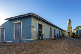 Blue tourist shop in front of the church Convento de San Francisco de Asis, Trinidad, Cuba, Sancti