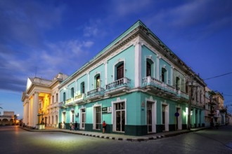 Turquoise residential building in the city centre of Santa Clara, Streetlife in the city centre of