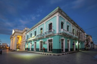 Turquoise residential building in the city centre of Santa Clara, Streetlife in the city centre of