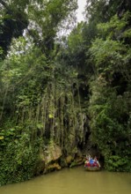 Exit of the cave system, tourists in an electric boat with life jackets, caves of the Indios, Cueva