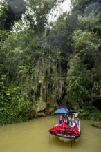 Exit of the cave system, tourists in an electric boat with life jackets, caves of the Indios, Cueva