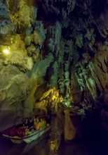 Tourists in a boat on the underground rivers in the caves of the Indios, Cueva del Indio,