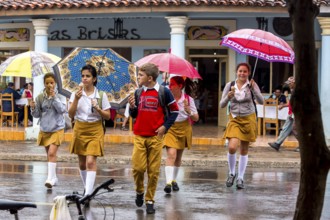 School children, pupils crossing a street in Vinales, Viñales, Cuba, Pinar del Río, Viñales, Pinar
