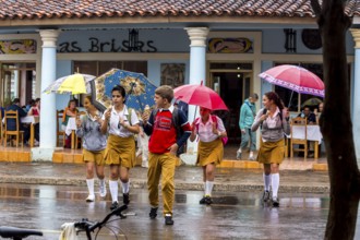 School children, pupils crossing a street in Vinales, Viñales, Cuba, Pinar del Río, Viñales, Pinar