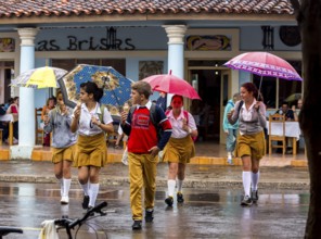 School children, pupils crossing a street in Vinales, Viñales, Cuba, Pinar del Río, Viñales, Pinar