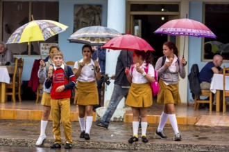 School children, pupils crossing a street in Vinales, Viñales, Cuba, Pinar del Río, Viñales, Pinar