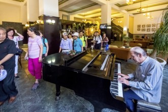 Hotel Amos Mundos, hotel of the writer Ernest Hamingway in Havana, lobby of the hotel with piano