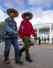 Two cowboys with riding boots and spurs on the street in Vinales, Viñales, Cuba, Pinar del Río,