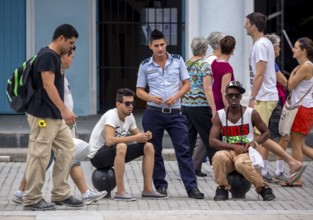 Young Cuban policeman with teenagers, La Habana, Cuba, Caribbean, Central America, Cuba, Europe,