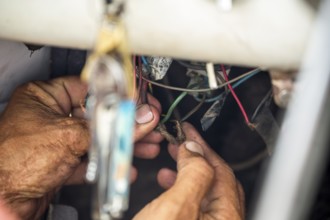 A classic car being short-circuited, car electrics in Cuba, La Habana, Cuba, Caribbean, Central