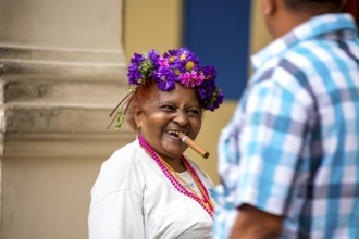 Old Cuban woman with cigar addresses tourists, La Habana, Havana, Cuba, Cuba, Europe, aerial view,