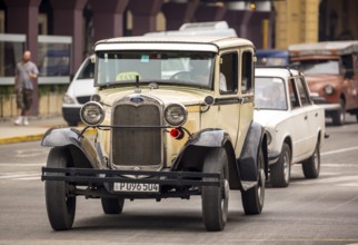 Ford vintage car in street scene, Old American road cruiser on the streets of Havana, Taxi, La