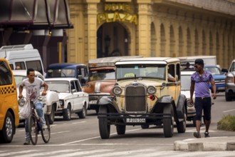 Ford vintage car in street scene, Old American road cruiser on the streets of Havana, Taxi, La