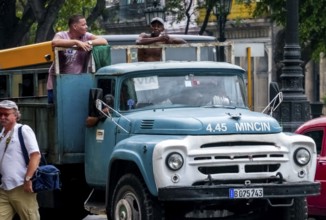 Oldtimer in street view, lorry with workers on the loading area, La Habana, Havana, Cuba, Cuba,