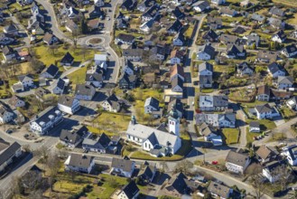 Aerial view, Roman Catholic parish church St. Kunibertus Kirche Hünsborn und Wohngebiet Ortsansicht