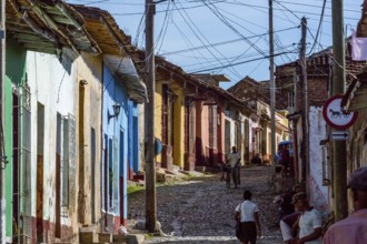 Street scene in Trinidad with cobbled street and terraced houses, electrical installations,
