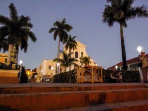 Ingelsia de la Santisima Trinidad with lantern in the centre of Trinidad with palm trees, Trinidad,