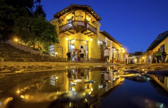 Restaurant and pub in the old town of Trinidad with visitors during the blue hour, Trinidad, Cuba,