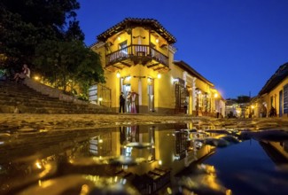 Restaurant and pub in the old town of Trinidad with visitors during the blue hour, Trinidad, Cuba,