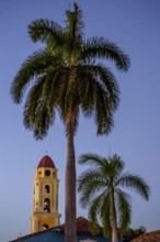 Church Convento de San Francisco de Asis of Trinidad with palm trees in the blue hour, Trinidad,