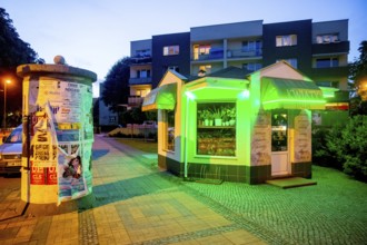 Green illuminated kiosk, blue hour, ÅšwinoujÅ'cie, Swinoujscie, Baltic Sea coast, Baltic Sea,