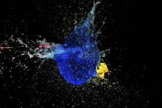 A blue water balloon explosion with yellow accents, triggered by an arrow, in a dynamic scene,
