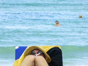 Sunbathing on loungers, reading on holiday, Varadero, Cuba, Matanzas, Cuba, Central America