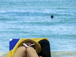 Sunbathing on loungers, reading on holiday, Varadero, Cuba, Matanzas, Cuba, Central America
