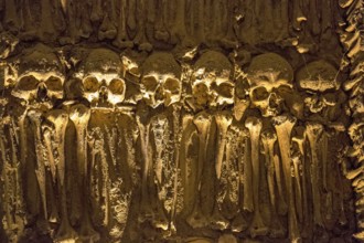 Piled bones in the ossuary, Capela dos ossos parede, chapel of bones, bone chapel, ossuary in