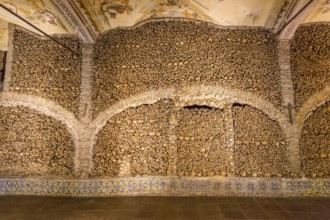 Piled bones in the ossuary, Capela dos ossos parede, chapel of bones, bone chapel, ossuary in