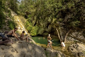 Small bathing lake in the Valle de los Ingenios with tourists, Trinidad, Cuba, Sancti Spíritus,