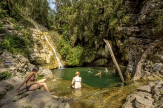 Small bathing lake in the Valle de los Ingenios with tourists, Trinidad, Cuba, Sancti Spíritus,