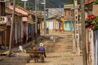 Cuban rider cowboy with his horse in the streets of Trinidad, Trinidad, Cuba, Sancti Spíritus,