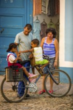 Street scene with children and bicycle in the old town of Trinidad, Trinidad, Cuba, Sancti
