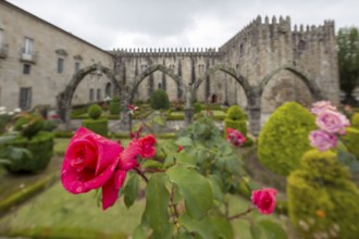 Jardim de Santa Barbara borders the crenellated facade of Antigo Paco Episcopal, former
