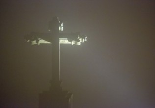 Cross of Bom Jesus do Monte, pilgrimage church of Braga in the evening fog, Braga, district of