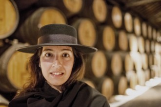 Classic travel guide with student robe, zorro hat and cape, port wine barrels, wine cellar of the