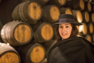 Classic travel guide with student robe, zorro hat and cape, port wine barrels, wine cellar of the