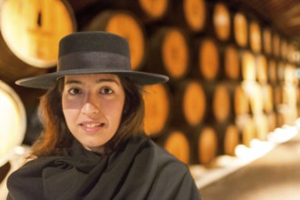 Classic travel guide with student robe, zorro hat and cape, port wine barrels, wine cellar of the