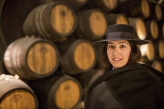 Classic travel guide with student robe, zorro hat and cape, port wine barrels, wine cellar of the