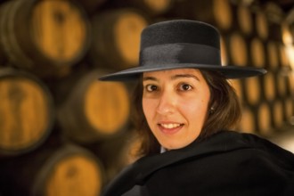 Classic travel guide with student robe, zorro hat and cape, port wine barrels, wine cellar of the